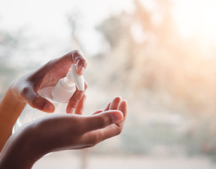The hand of a woman who is using an alcohol gel to clean, prevent the virus, Covid 19.