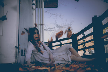 Portrait of asian woman make up ghost face with blood,Horror scene,Scary background,Halloween...