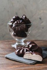 Homemade souffle candy in chocolate with vanilla. Candy bird's milk. Traditional russian zephyr in chocolate. Marshmallow