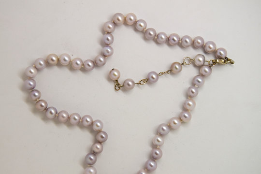White fancy pearl necklace on a white background