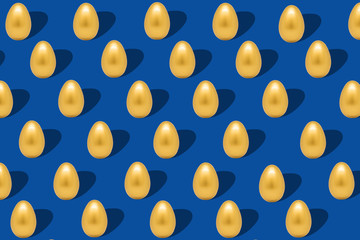 Pattern with gold eggs on dark blue backdrop easter background.
