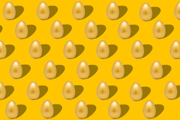 Pattern with gold eggs on yellow backdrop easter background.