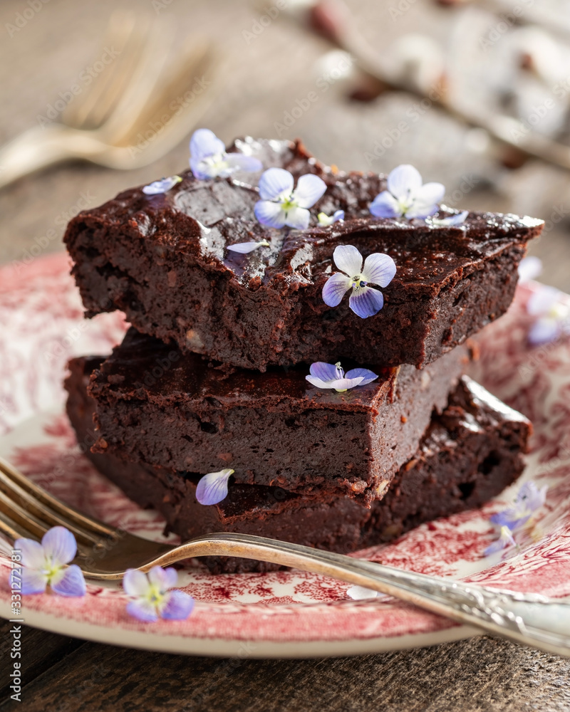 Wall mural Chocolate brownies with wild edible plants