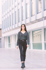Obraz premium Young girl walking on the street