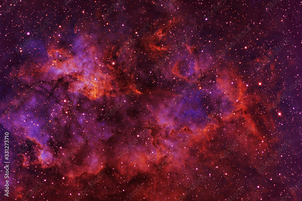 Wall mural beautiful galaxy of red color with stars. elements of this image were furnished by nasa.