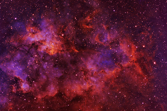Beautiful galaxy of red color with stars. Elements of this image were furnished by NASA. © Artsiom P