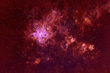 Beautiful galaxy of red color with stars. Elements of this image were furnished by NASA.