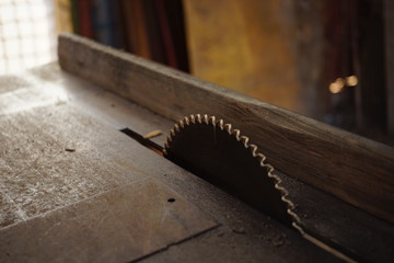 Metal dish of eletrical saw machine in the old table.