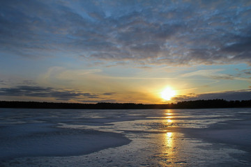 Fototapeta na wymiar Winter landscape with beautiful frozen lake at sunset.