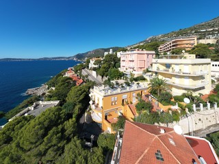 Naklejka na ściany i meble France, Cote Dazur, Beaulieu, 02 October 2019: Aerial view of French Riviera's terraces of expensive country houses and estates, palm trees, pools, stony coast, Chaise lounges