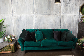Obraz na płótnie Canvas comfortable soft green divan in a interior