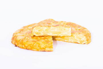 Traditional spanish omelet with a slice on top