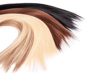Long hair extensions in natural colors. Black, brown, blonde, and blonde balayage.