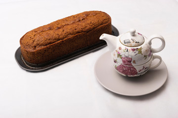 Carrot cake freshly brewed and tea cup for breakfast