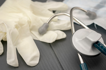 close-up of latex gloves, stethoscope and mask to fight coronavirus, other viruses and bacteria