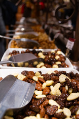 Selective focus, Close-up belgian pralines in the bowl, covered with white shugger powder and stainless steel scoop