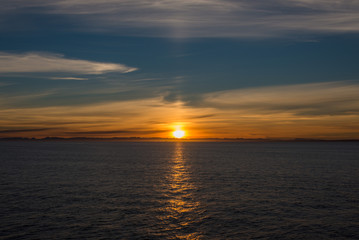 Beautiful sinrise in Greenland. Iceberg at sea.