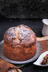 Homemade Easter cake. Easter cake on a dark background. Panettone. Easter recipe.