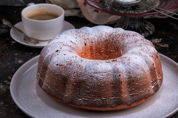 Bundt Cake perfect for parties, breakfast or dessert. Classic Vanilla Bundt Cake. Lemon Butter Bundt Cake served with cup of coffee.