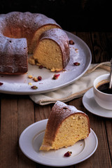 Bundt Cake perfect for parties, breakfast or dessert. Classic Vanilla Bundt Cake. Lemon Butter Bundt Cake served with cup of coffee.