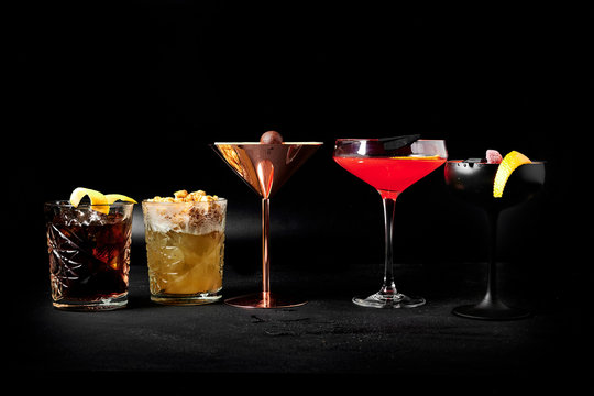cocktail on a black background, assorted cocktails, minimalism in cocktails