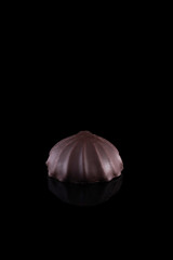 Chocolate Chip Cookies Chocolate marshmallows on a black background. Marshmallows and reflection.