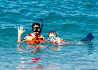 Mother and Young Son Snorkeling with Life Jackets in the Ocean at Punta Mita, Nayarit, Mexico
