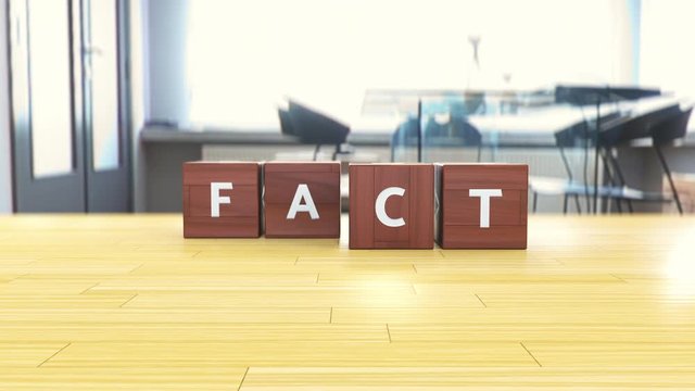 Wooden blocks spelling out Fake fact, misleading information, myth busted
