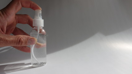 Pushing Spray Bottle Dispenser With Alcohol Based Sanitizer Into Air Aerosol