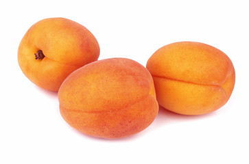Ripe fresh yellow peaches isolated on a white background.