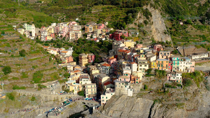 Fototapeta na wymiar Village of Manarola in aerial view, Cinque Terre coast of Italy. Manarola is a small town in the province of La Spezia, in Liguria, in northern Italy