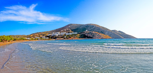 superb panoramic view of the sandy beach of Galissas, on Syros, famous Cyclades island, in the heart of the Aegean Sea © Mariedofra