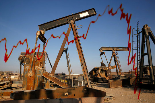 Old oil pump jacks at a scrap yard, Oman