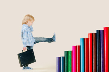 a small blond-haired boy of five years with a backpack steps on the stairs from pencils. surrealism, goal achievement