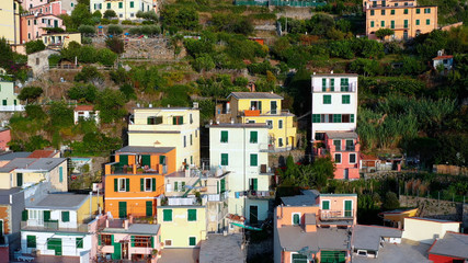 Fototapeta na wymiar Aerial view of Riomaggiore Cinque Terre. This is a traditional and colorful fishing village near a cliff on the Mediterranean Sea, located on the Ligurian coast in Italy.