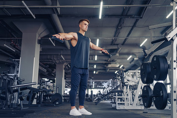 Young Man Preforming Dumbbell Lateral Raise - Exercise For Shoulders.