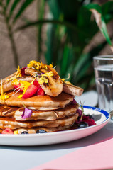 Pancakes with salted caramel , berries and banana