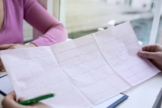 Closeup photo of ECG cardiogram pulse graph on a paper.
