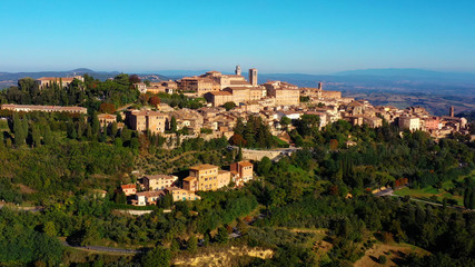 Fototapeta na wymiar Authentic village of Montepulciano. A beautiful old town with red roofs in Tuscany, Italy. Perfect for travels and vacations - aerial view with a drone 