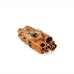 Cinnamon sticks tied with twine isolated on white background. Spices for drinks and pastries.  