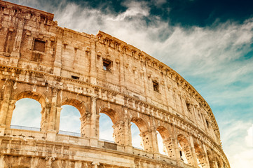 Fototapeta na wymiar Colosseum against the sky in Rome, Italy. Famous travel destination