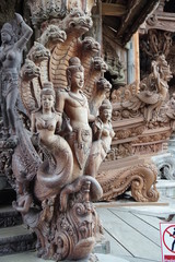 Fototapeta na wymiar Wood carving art in sanctuary of Truth (or Prasat Sajja Tham), it's all wood building filled with traditional sculptures at Pattaya, Thailand