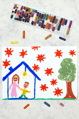 Photo of colorful drawing: Coronavirus epidemic. Stay at home. Mother and son in a house.