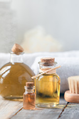 Concept of using natural oil in cosmetology. Moisturizing skin care. Gentle body treatment. Atmosphere of harmony, relax, spa, aromatherapy. Copy space for text, wooden background