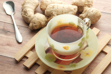 green tea with ginger on table, close up