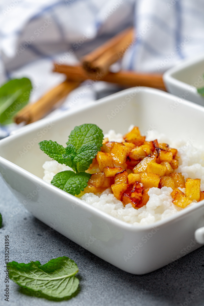 Wall mural rice porridge with almond milk and caramelized apples.