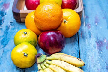 red and green apples oranges and tasty tangerines along with other fruits