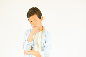 Little boy making thoughtful gesture