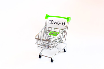 Empty shopping trolley with covid-19