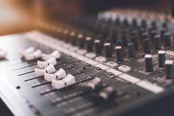 Sound mixer. Professional audio mixing console with lights, buttons, faders and sliders.